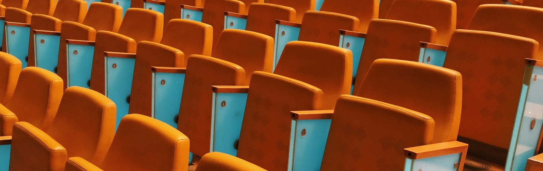 Photograph of empty seats in a conference hall