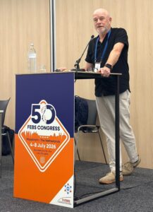 Man standing behind a podium.